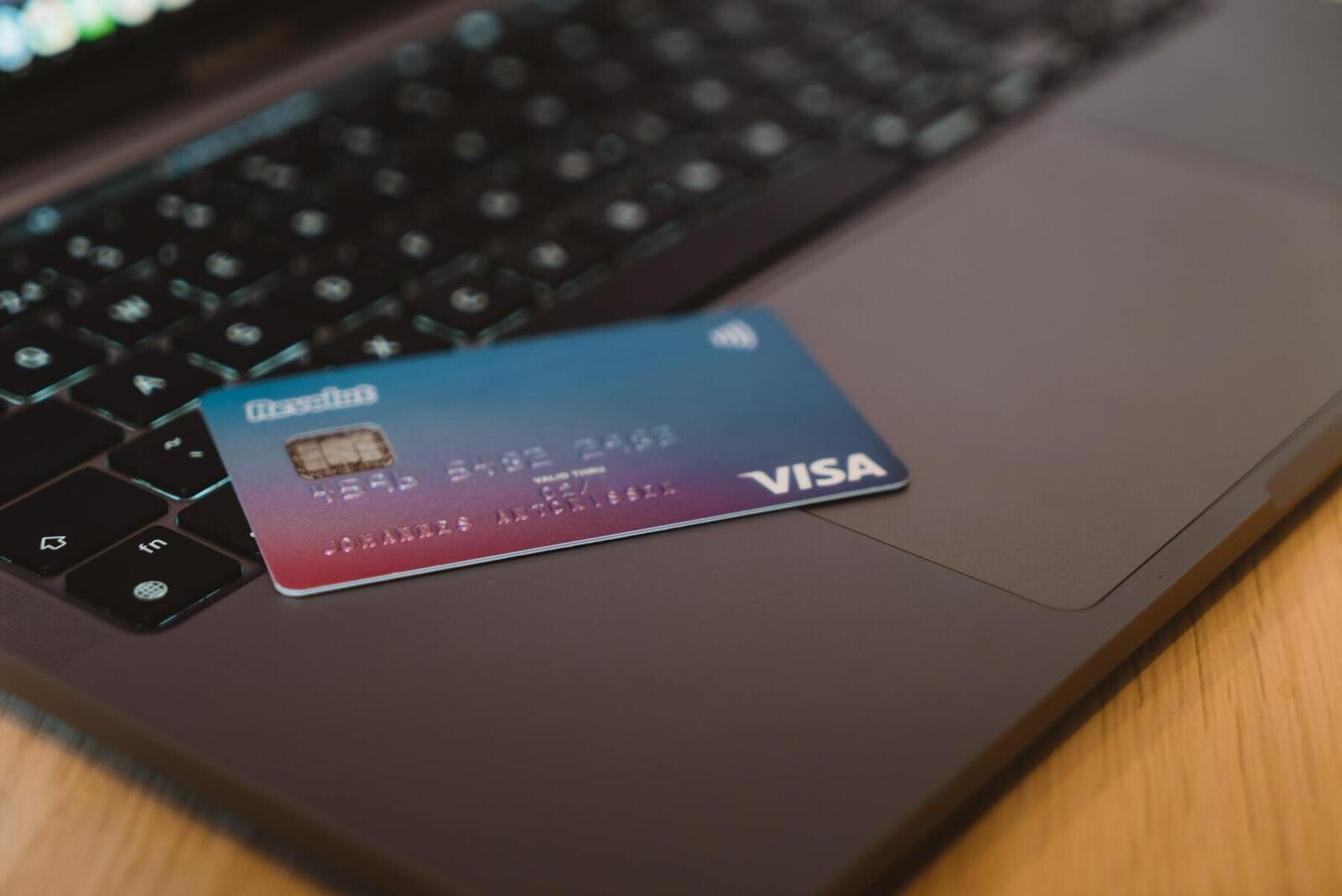 Credit card on a laptop keyboard for secure online payments